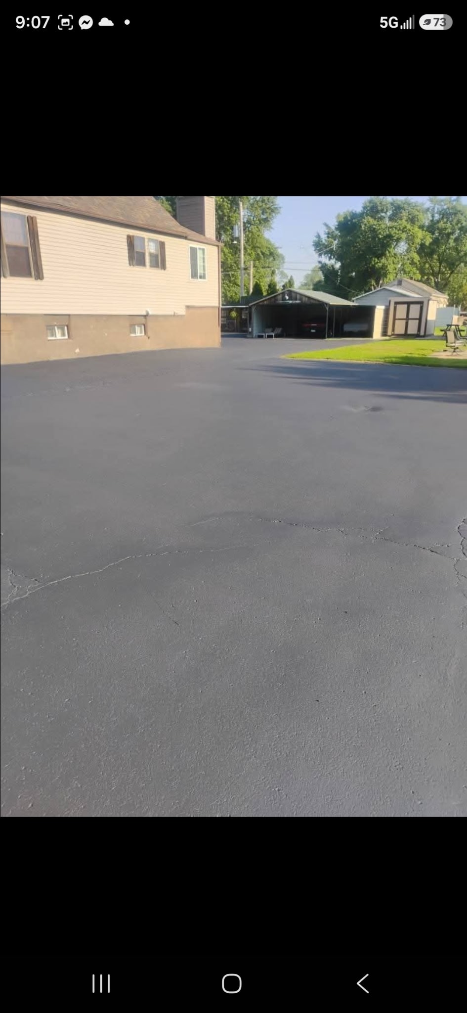 Residential driveway after sealcoating — Silver Lining Asphalt