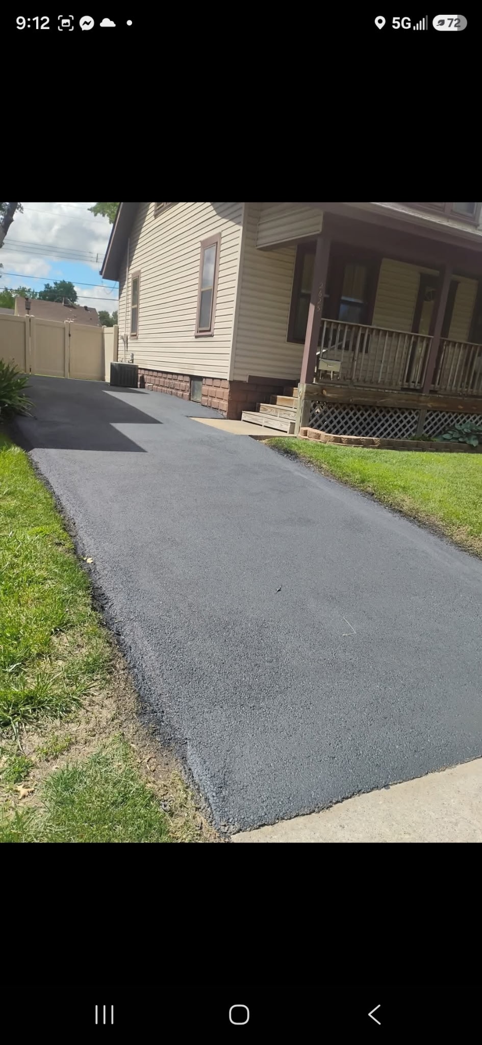 Driveway after sealcoating with caution tape — Silver Lining Asphalt