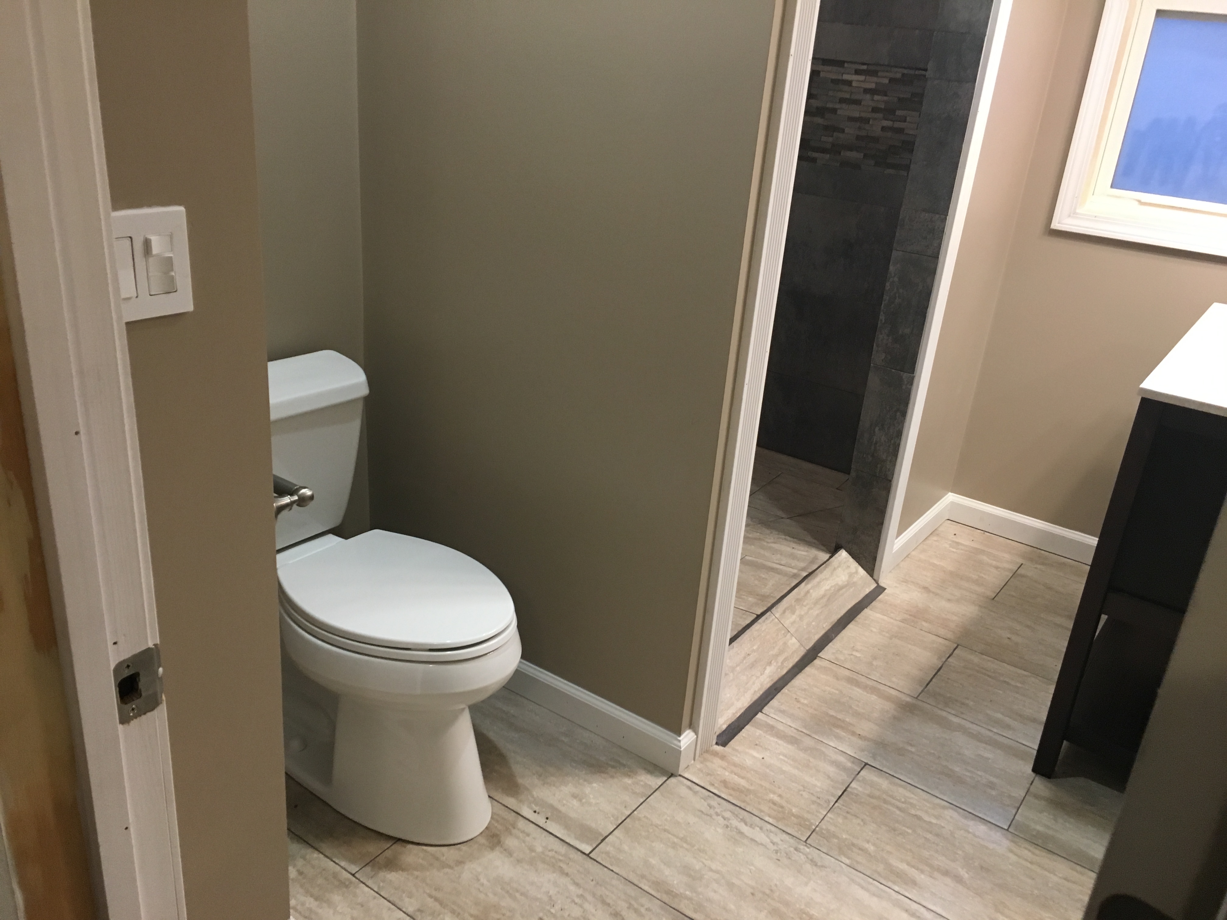 Bathroom after remodel — new tile shower and vanity