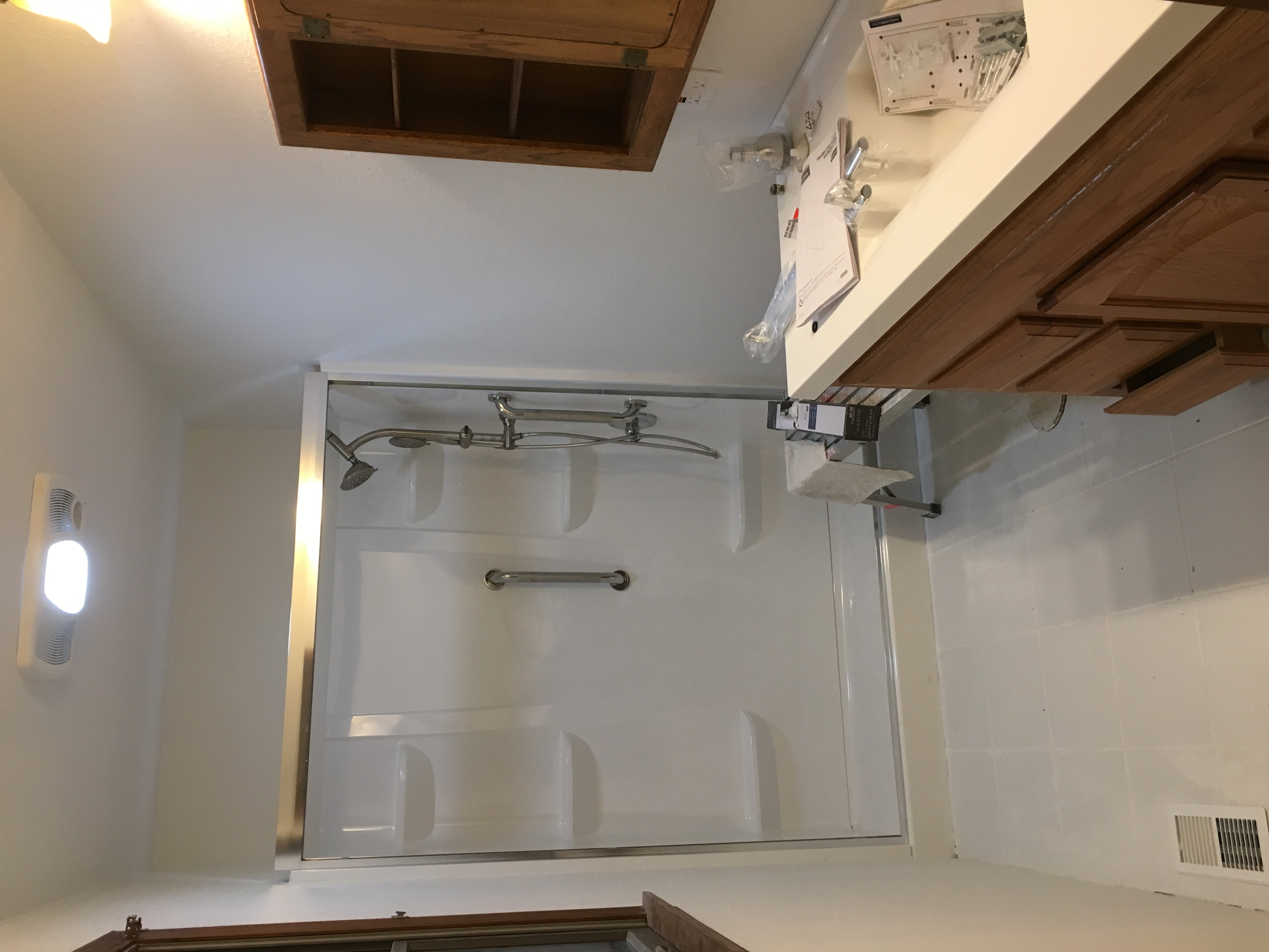 Bathroom after remodel — new vanity, mirror and lighting